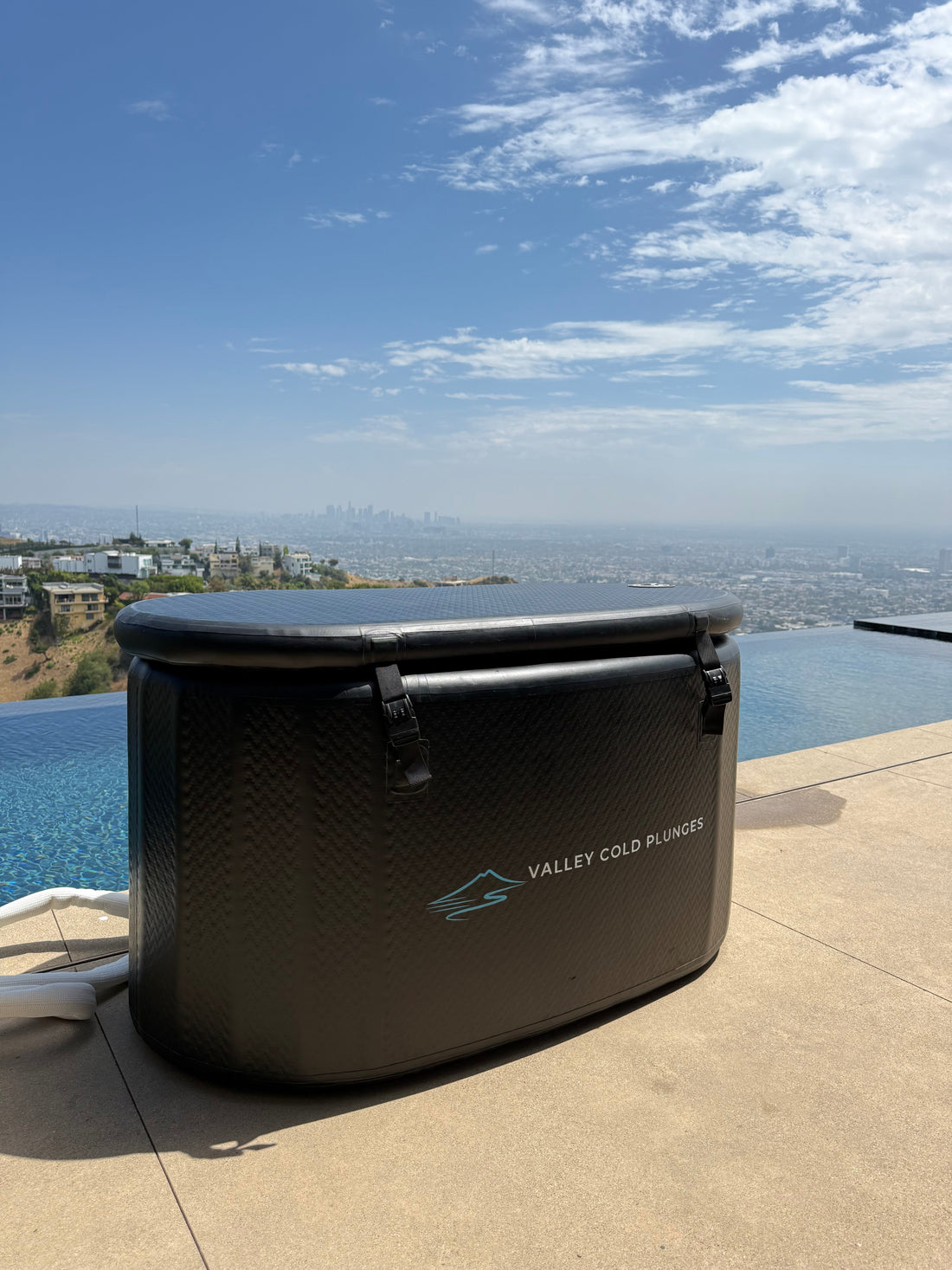 Black Valley Cold Plunges tub on a Beverly Hills pool deck overlooking Los Angeles